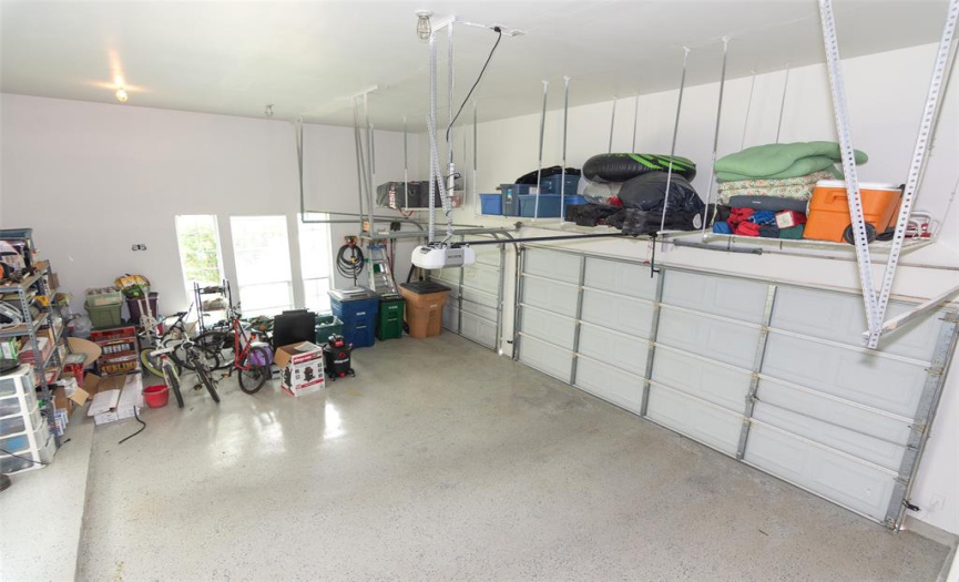 3 car garage with shelving