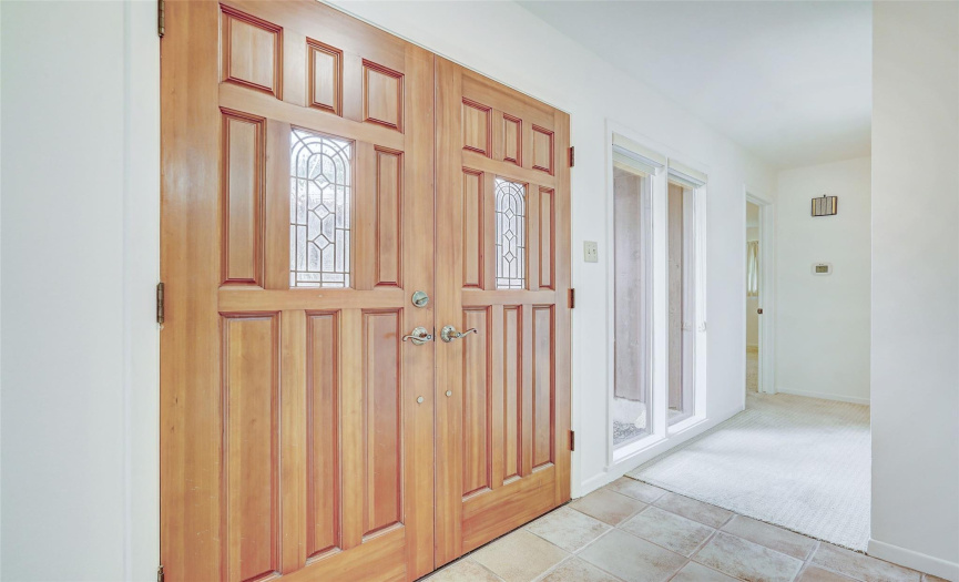These solid wood doors exude warmth and richness to the house as you're welcomed home. 