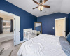 Blue accent walls in large room allowing a king size bed
