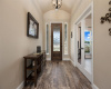 Gorgeous entry with upscale wood plank tile floors.