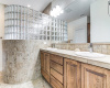 Notice this awesome glass block walk-in shower.