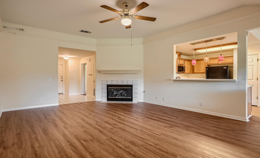 Are you ready for some family time?  Recent LVP flooring. This large Living space with corner fireplace is large and open to kitchen/dining area .