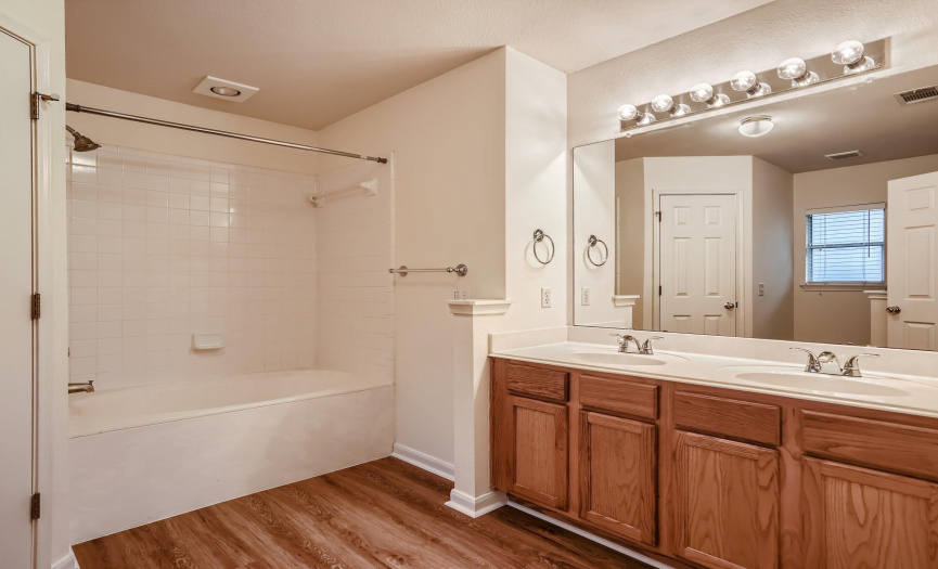 Master Bath with 2 sinks and large garden tub/shower combo. Toilet private and a large walk-in closet.
