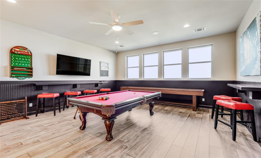 A spacious game room is housed on the second level.