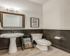Convenience is key, with a main level powder room offering easy access for guests.