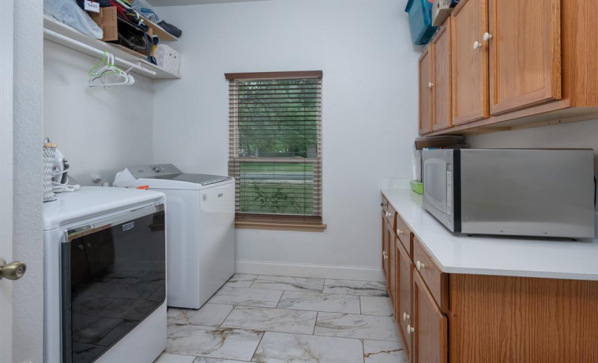 Large laundry room conveniently located nearby the kitchen