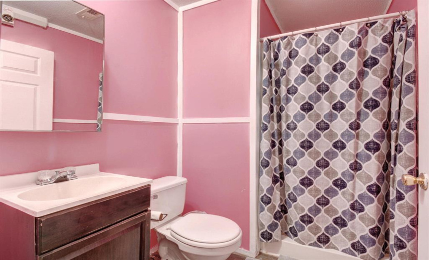 Bright colors add a bright vibe to this full bath!  What a cheerful way to start your day!