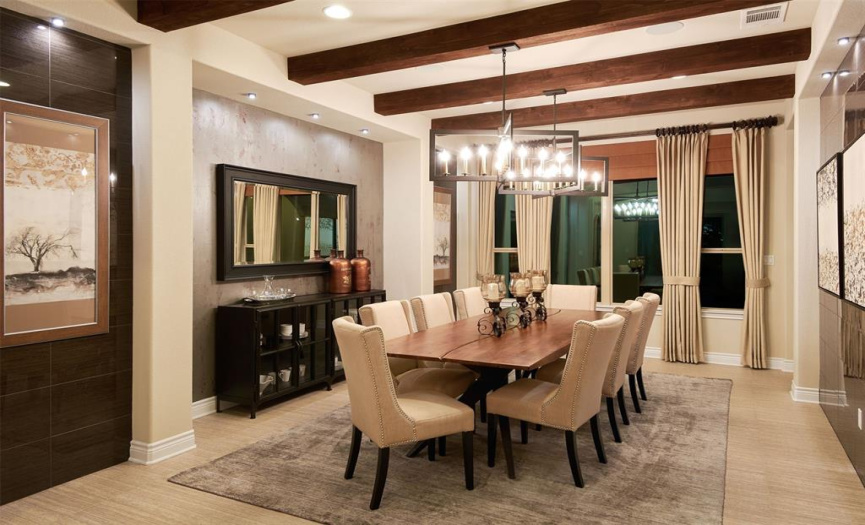 Adjacent to the kitchen, a beautifully appointed formal dining room awaits, perfect for hosting memorable gatherings with loved ones.