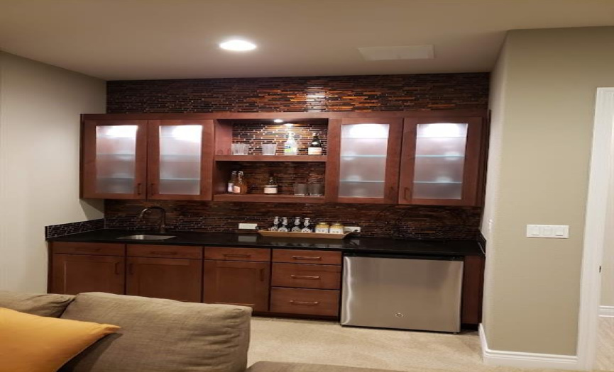 A full and custom wet bar in the media room will add on to any special time in the media room.