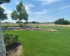 The tranquility of the backyard, offers complete privacy & breathtaking open field views. 