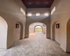 Enter the main home through a dramatic exterior walkway. 