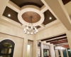 High ceilings throughout with custom beam work, tray ceilings, and specialty ceiling treatments.