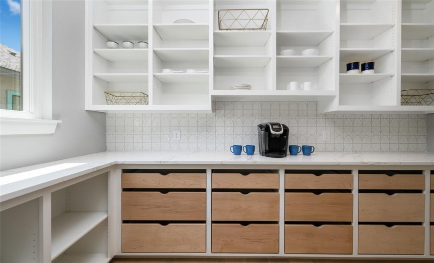 The perfect butler's pantry with lots of storage and gorgeous maple-front drawers.