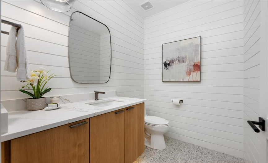 Shiplap and a white oak vanity really dress this powder bath up, don't you think? 
