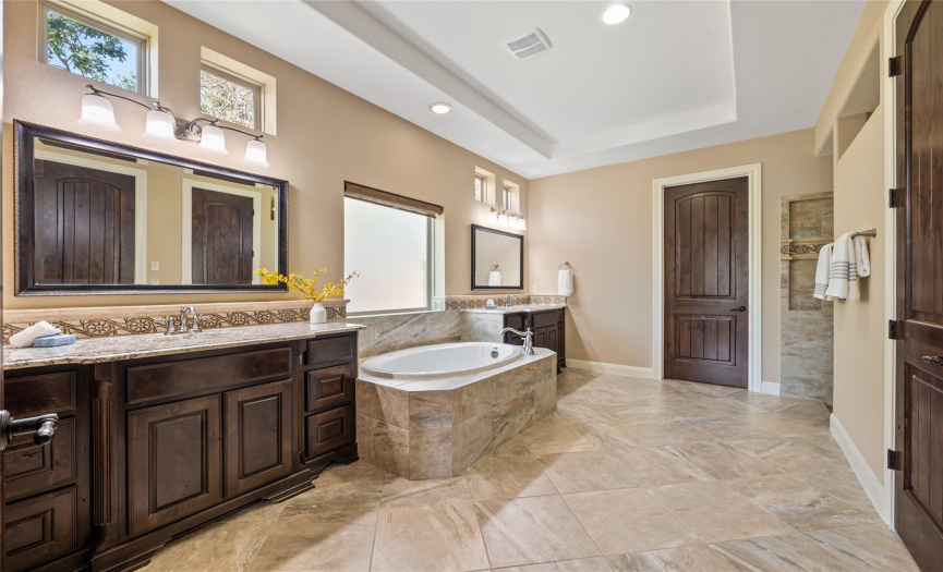 Large master bathroom with double vanity, walking shower and walking closets