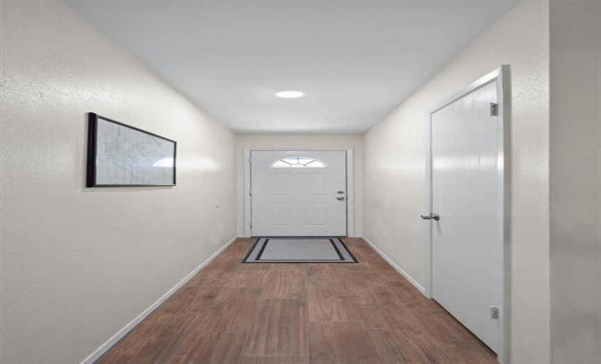 Spacious entry way leaves room for a phot gallery!
