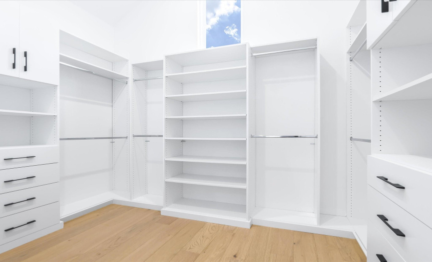 The thoughtfully designed walk-in closet offers ample storage, keeping your personal items neatly organized