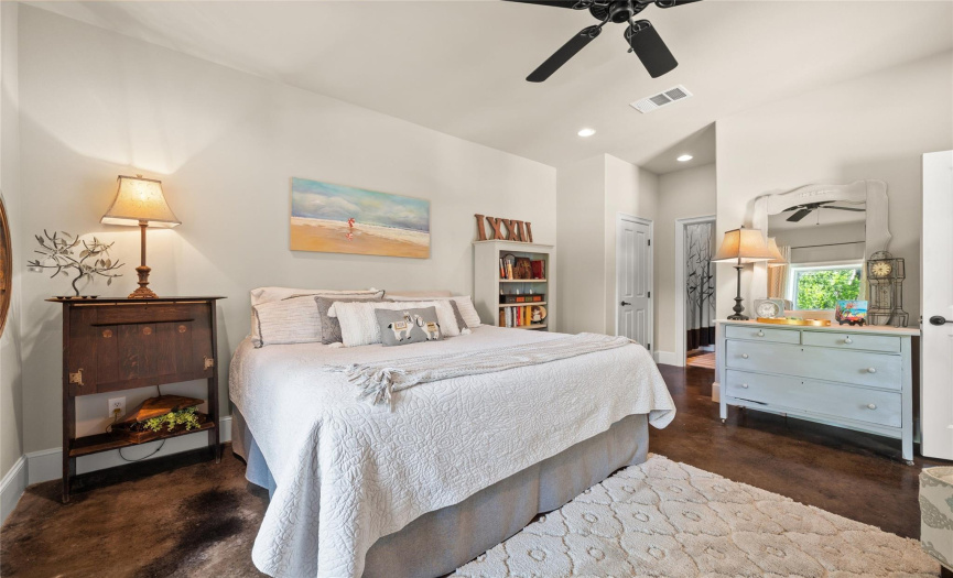 This private lower level bedroom becomes more than just a place to sleep – it's a retreat where you can escape, unwind, and rejuvenate, surrounded by the beauty of tall ceilings and a sense of seclusion.