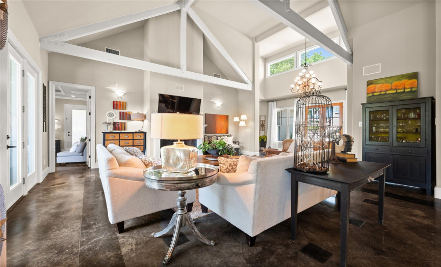 Whether you're hosting a dinner party, preparing a gourmet meal, or simply relaxing with a book, this open concept living and kitchen area offers an inviting and harmonious space to cater to all your needs.