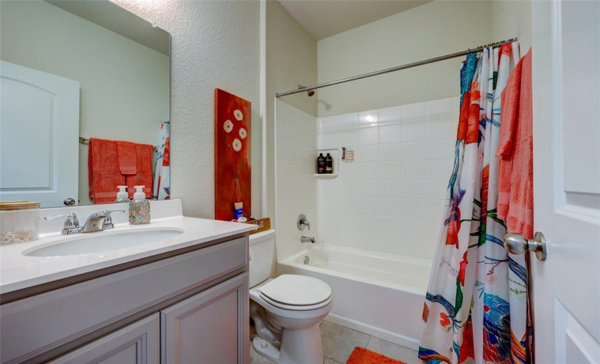 Full bath adajcent to the first floor bedroom. 608 Reinhardt Blvd, Georgetown TX 78626. MLS #1500692.