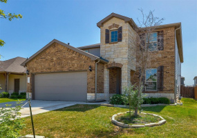 Soaring Texas limstone entry accents and full brick front facade welcome you home to 608 Reinhardt Blvd, Georgetown TX 78626 MLS #1599692
