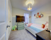 Secondary bedroom  - one of 2 additional bedrooms upstairs. 608 Reinhardt Blvd, Georgetown TX 78626. MLS #1500692.