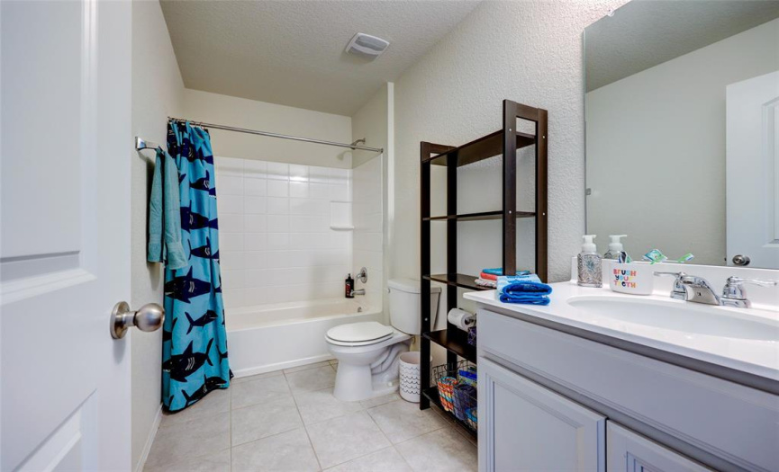 3rd full bath - shared by 2 upstairs bedrooms 608 Reinhardt Blvd, Georgetown TX 78626. MLS #1500692.