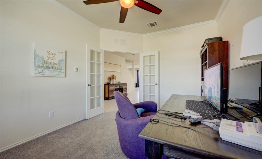 Crown moulding, ceiling fan and French doors are just some of the quality touches throughout this home. 608 Reinhardt Blvd, Georgetown TX 78626. MLS 1500692.