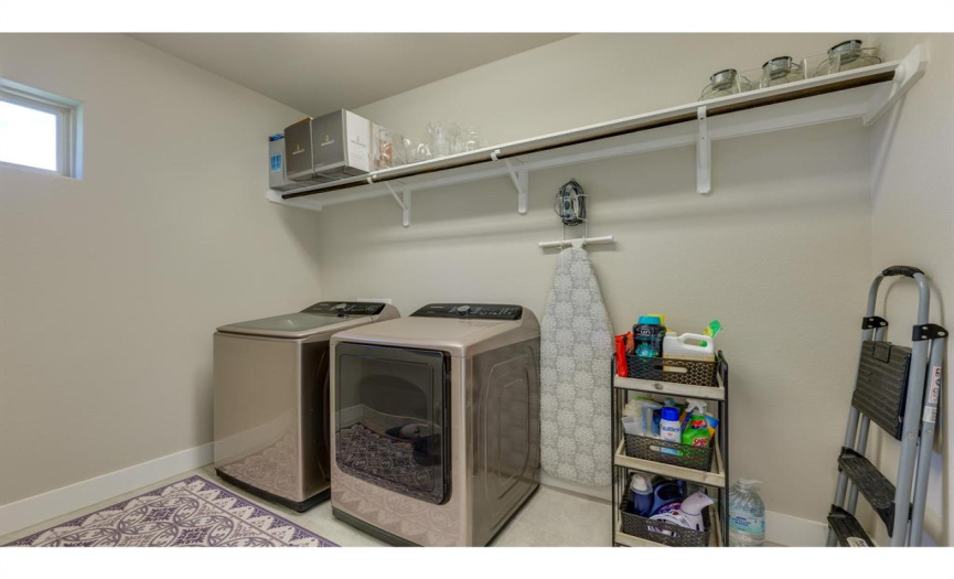 Love that the utility room has a window and nice shelving.