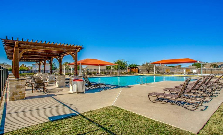 Resort style Pool area with shaded picnic areas