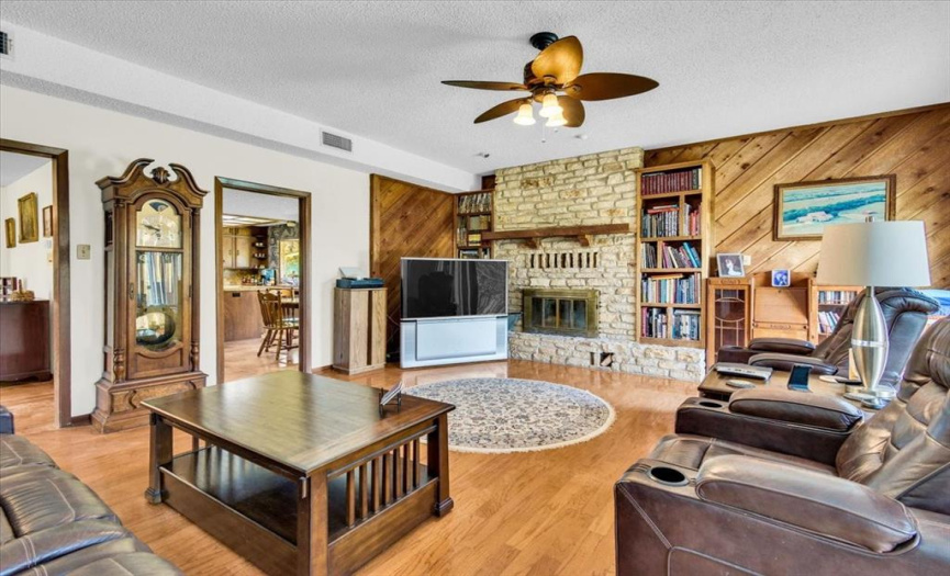 Large great room off the kitchen that leads out to the pool, hot tub & court.