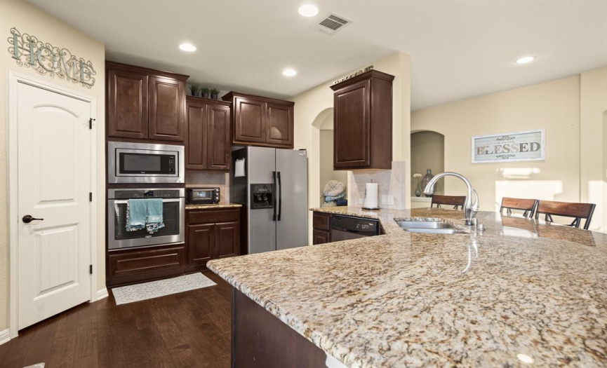 Stainless steel appliances, a built-in microwave over oven, and a nice sized pantry for your dry foods.