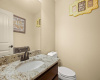 The half bathroom is elegant and convenient for guests.