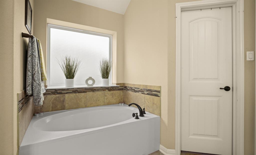 Enjoy relaxing in the deep soaking tub after a long day.