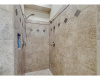 The walk-in shower, with dual shower heads, adds a spa-like experience to your morning routine