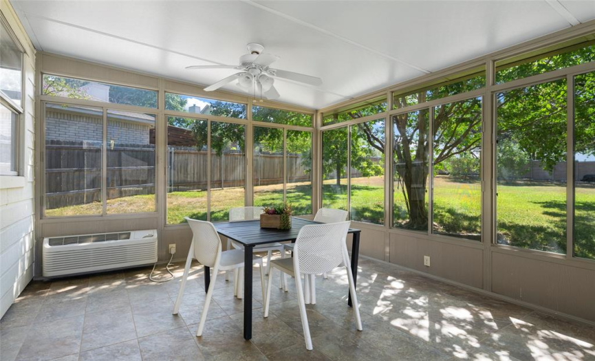 The air conditioned and heated sunroom is the perfect spot for relaxing and soaking in backyard fun!