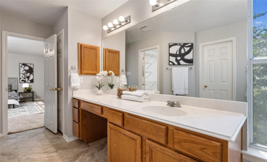 Primary Bath: ample vanity storage, huge walk-in closet, private water closet and large tub/shower combo