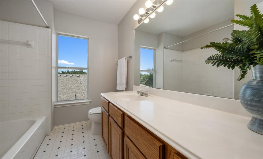 Secondary bath: amazing countertop space and plenty of storage in the vanity + a great tub/shower combo