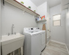 Large laundry room w/ sink & lots of natural light