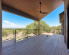 Deck with lake and hill country views