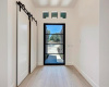 Front entry with handsome glass door and spacious storage closet