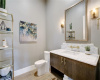 beautifully designed half bath perfectly situated near the living room and kitchen