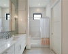 Ensuite bath for secondary bedroom with large walk in closet