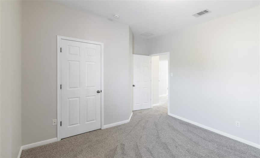 Bedroom 4 has a two-inch blinds, a standard closet, a ceiling light, and measures approximately 10 x11.