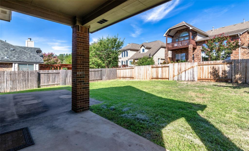 Back yard includes a covered patio with recessed lights as well as an uncovered patio.