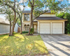 This beautiful home is nestled under mature trees on a quiet street in the sought-after Maple Run community in South Austin.