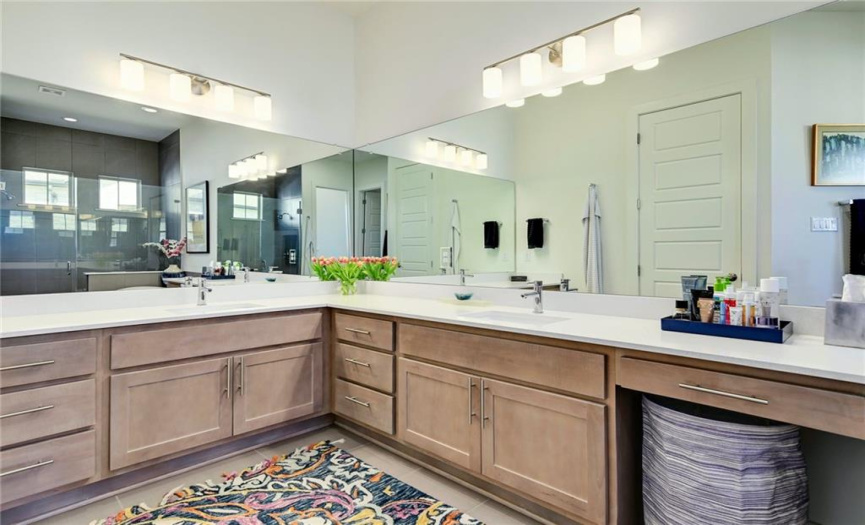 Plenty of space in this master bath. Spa like feeling with quartz counters and chrome fixtures