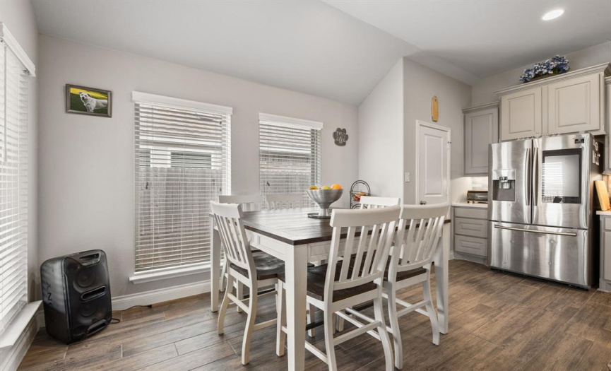 The sunny dining area provides ample space for a sizable kitchen table where you can enjoy home cooked meals with friends and family while enjoying the beautiful views. 