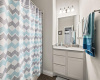 This secondary bathroom is located alongside two secondary bedrooms and offers a lovely vanity and a shower/tub combo. 