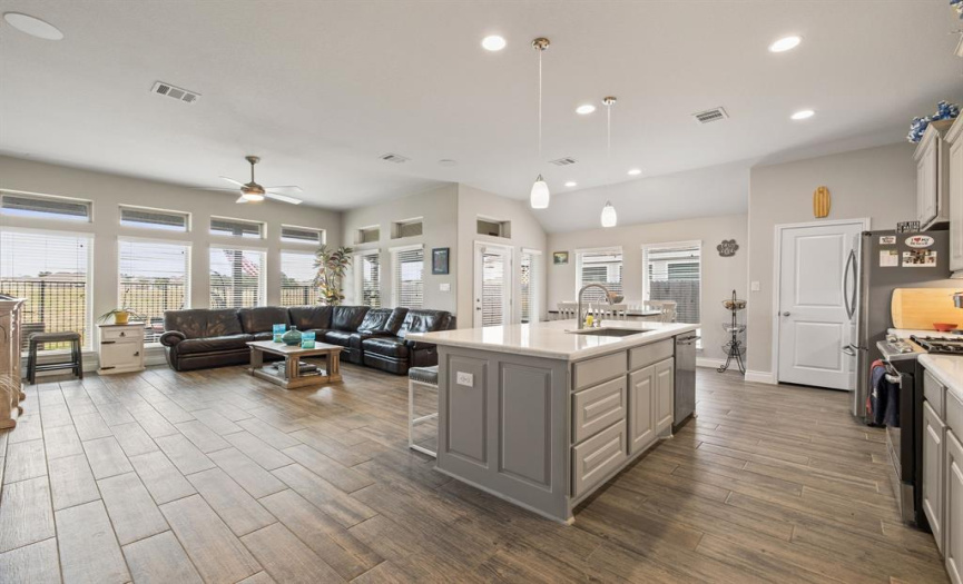 Featuring a luminous open floor plan for the living room, stylish contemporary kitchen, and sunny dining area. 